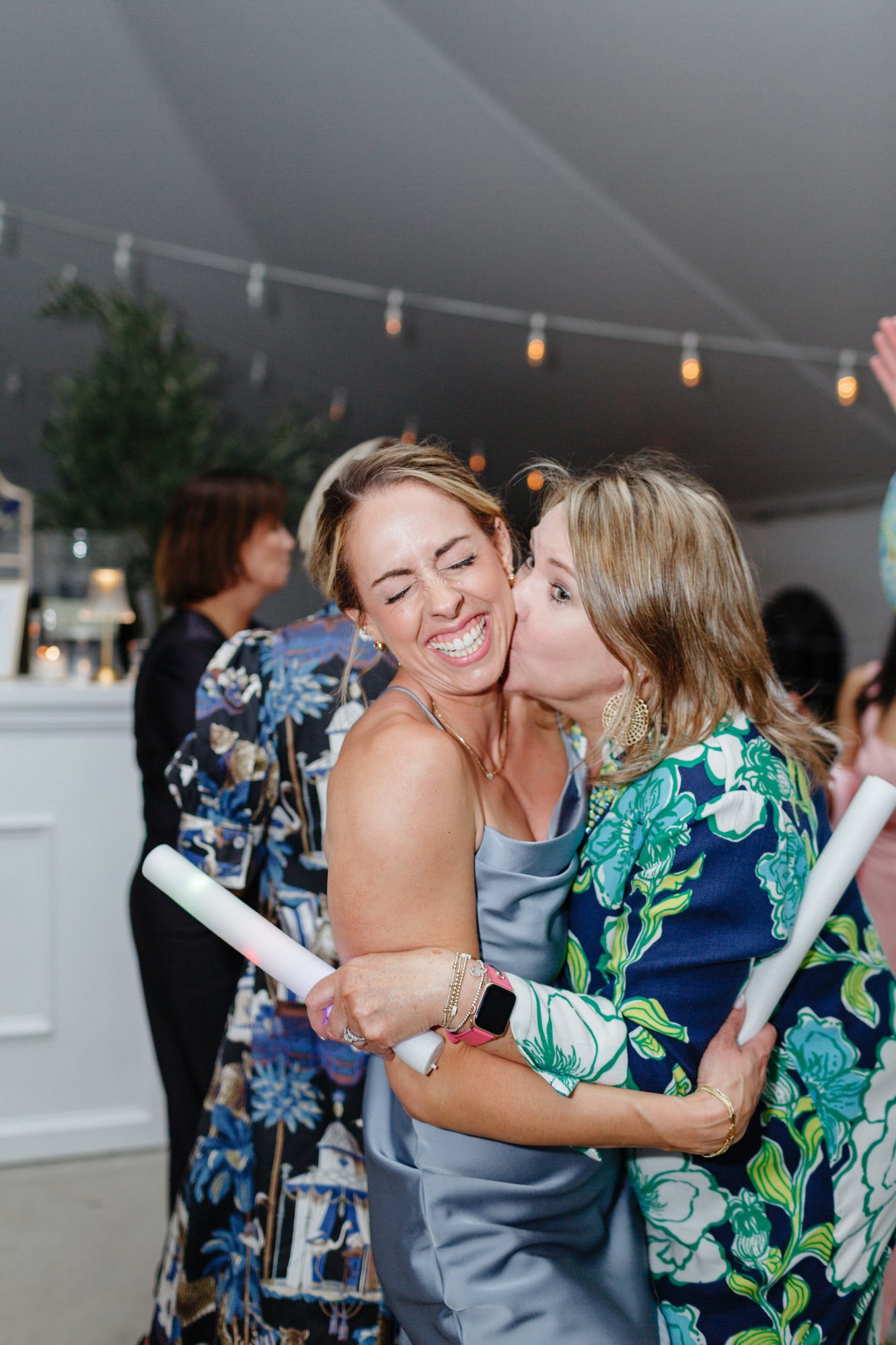 Bride hugging a guest on the dance floor at Historic Whitewood
