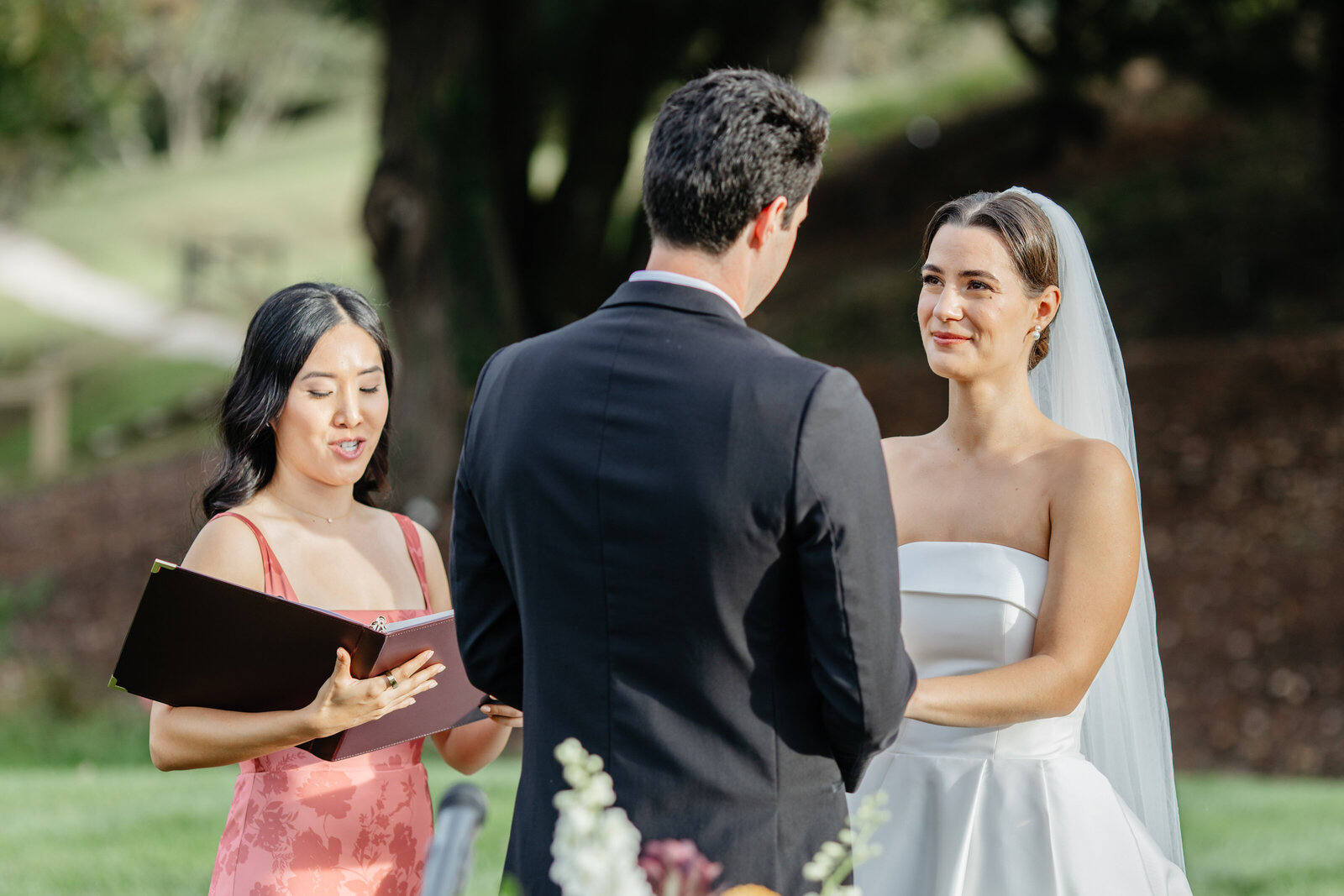 Couple facing each other during the ceremony at Boars Head Resort