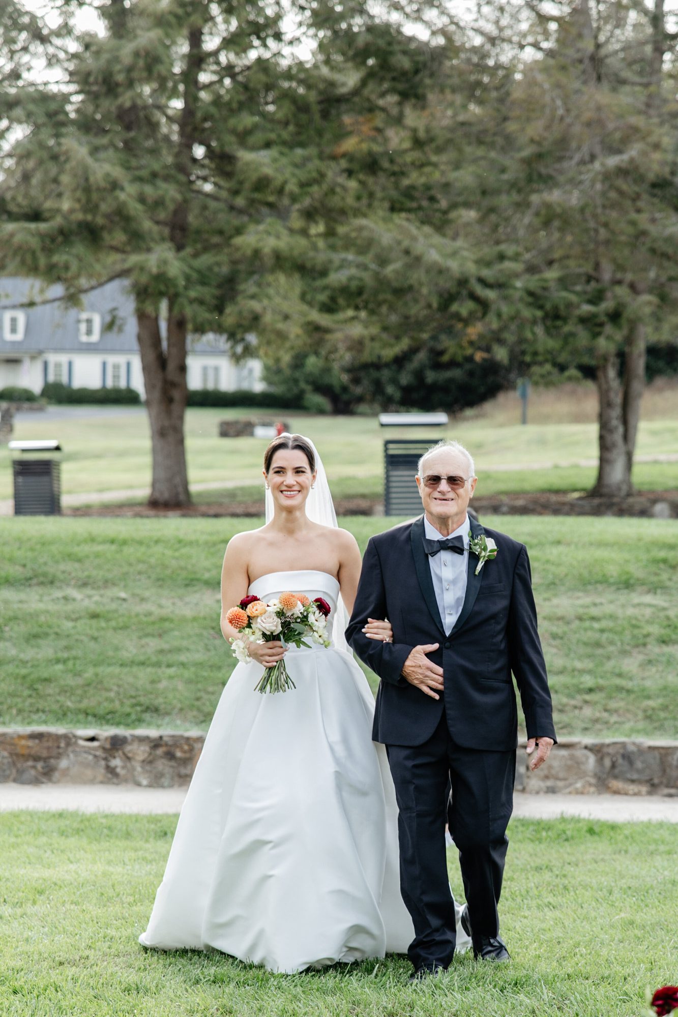 Bride walking with her father at Boars Head Resort