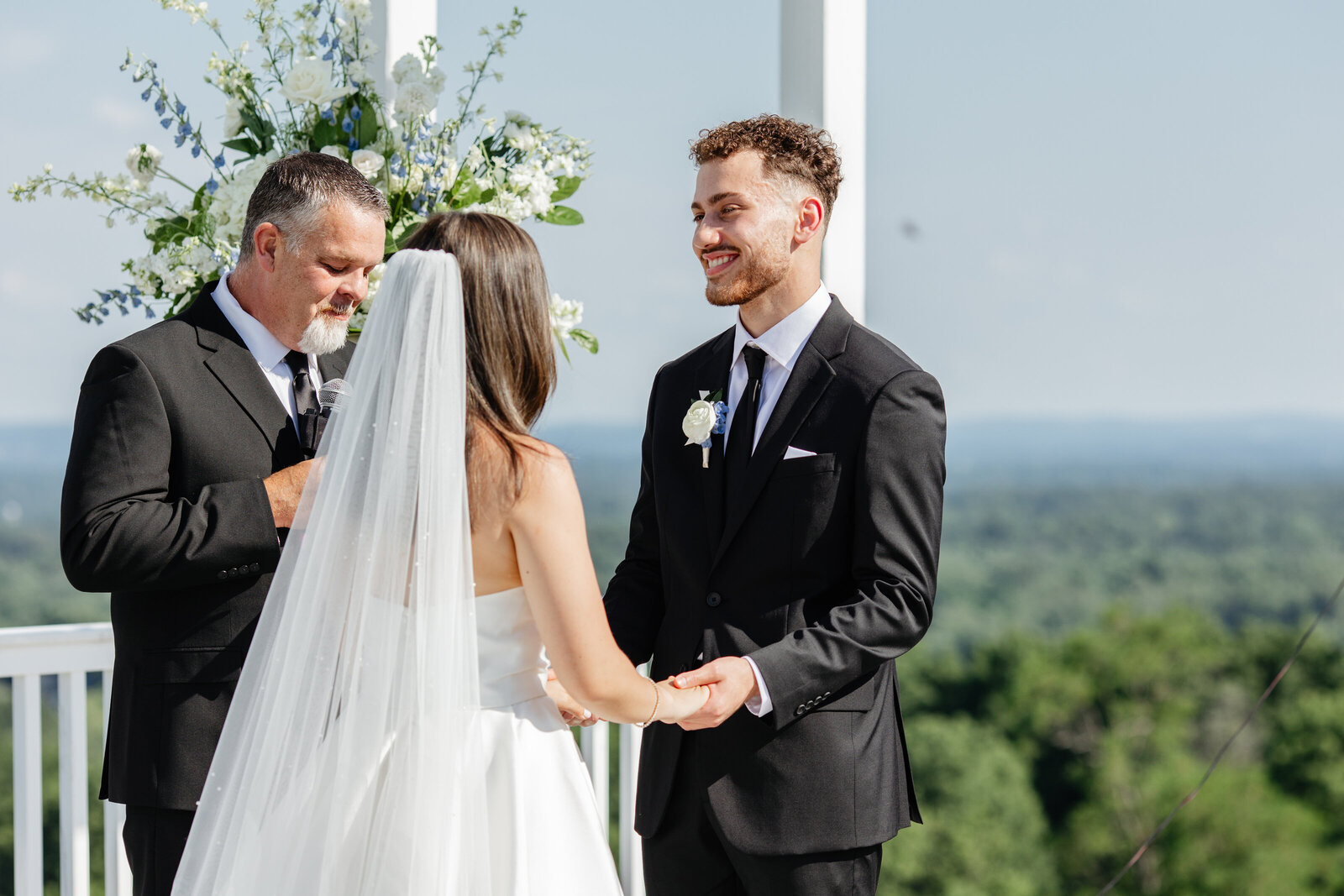 Couple laughing during the ceremony at The View at Bluemont