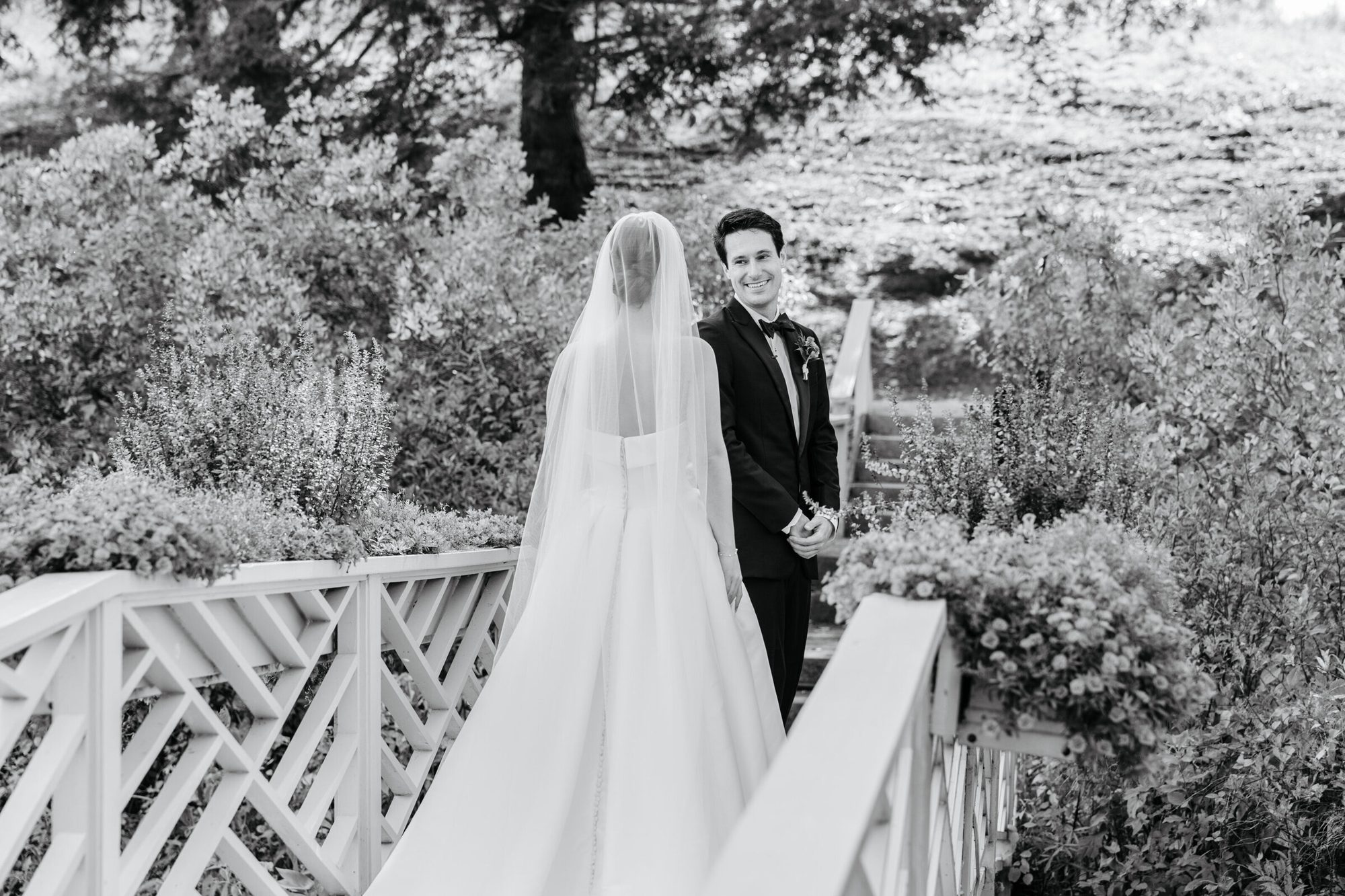 Black-and-white first look on the garden bridge at Boars Head Resort at Boars Head Resort