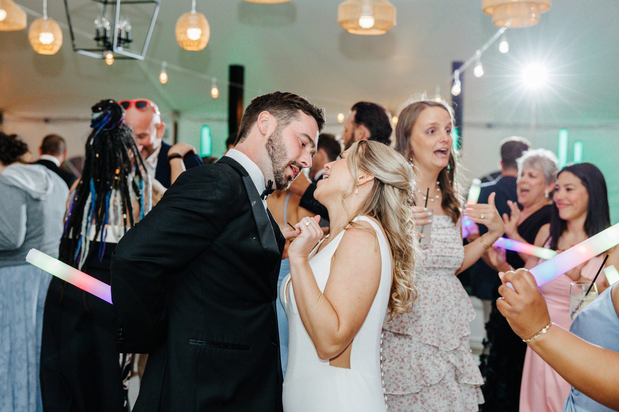 Couple dancing with guests under the tent at Historic Whitewood
