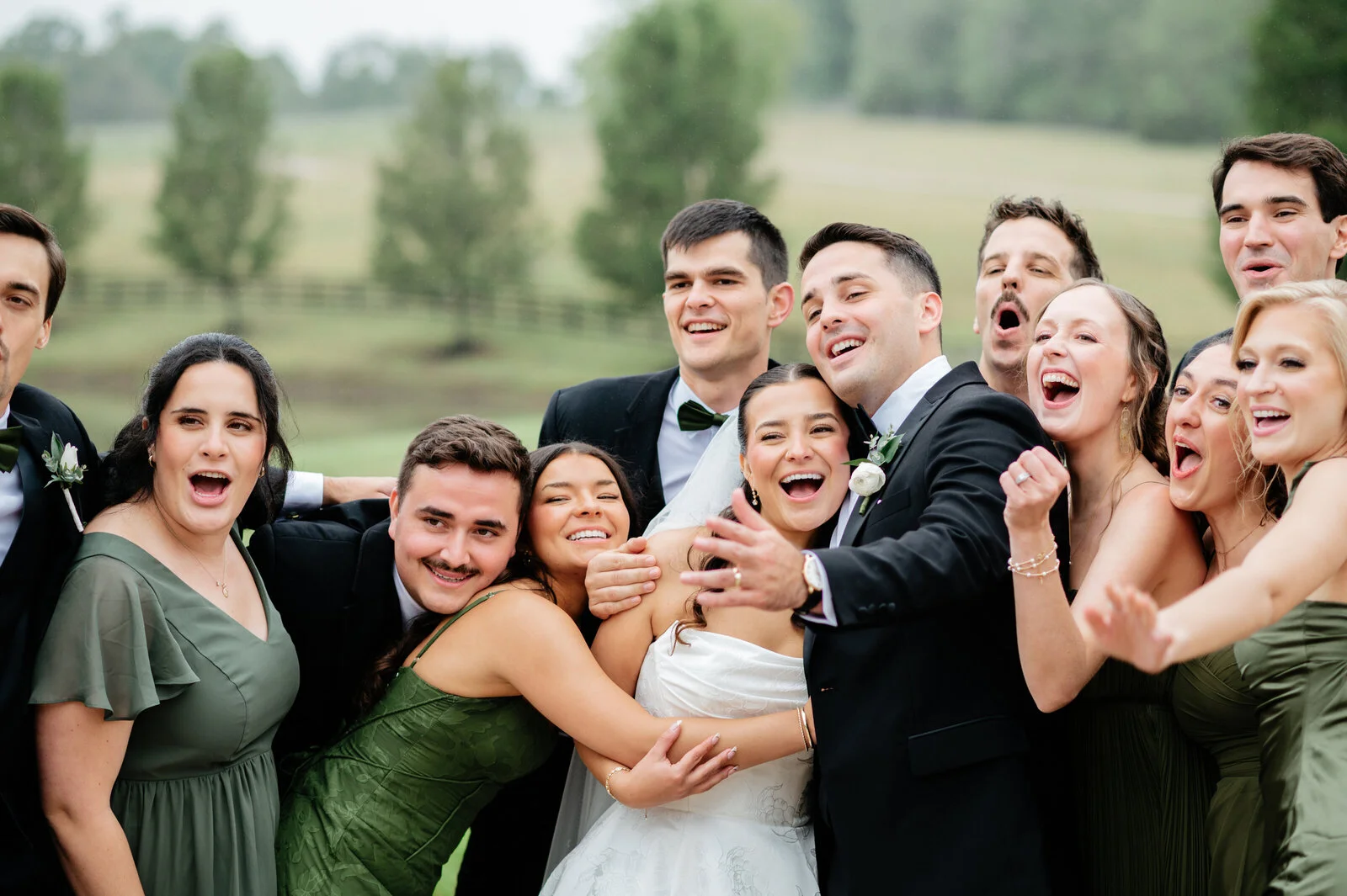 Wedding guests gathered around a bride and groom