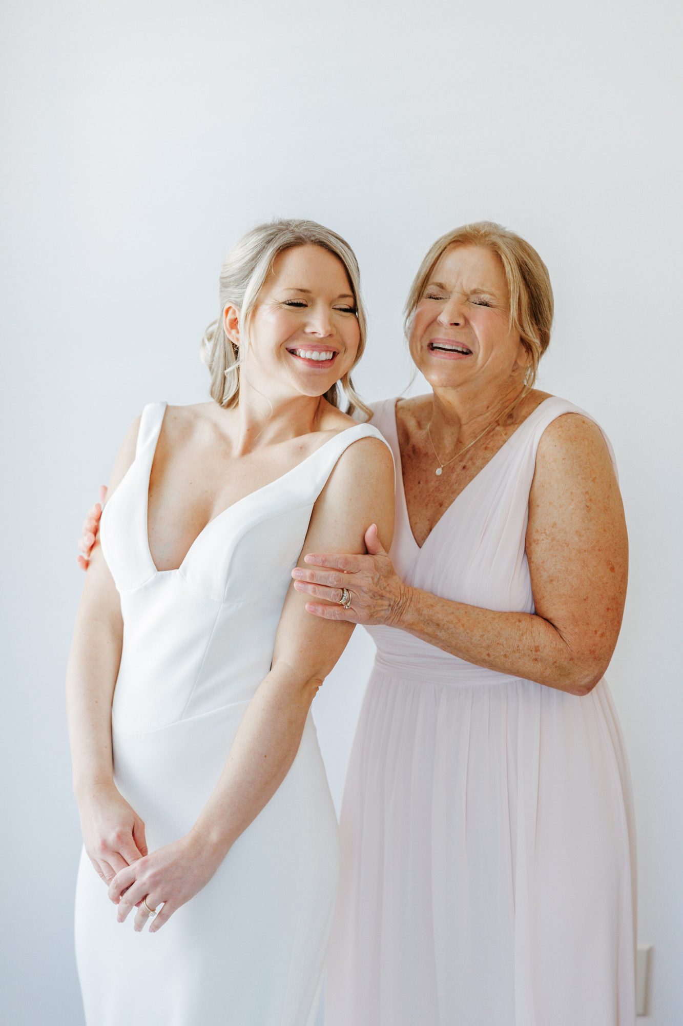 Bride laughing with her mother at Historic Whitewood