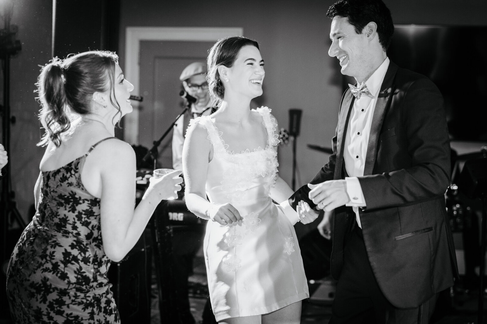 Black-and-white photo of the bride dancing with guests at Boars Head Resort