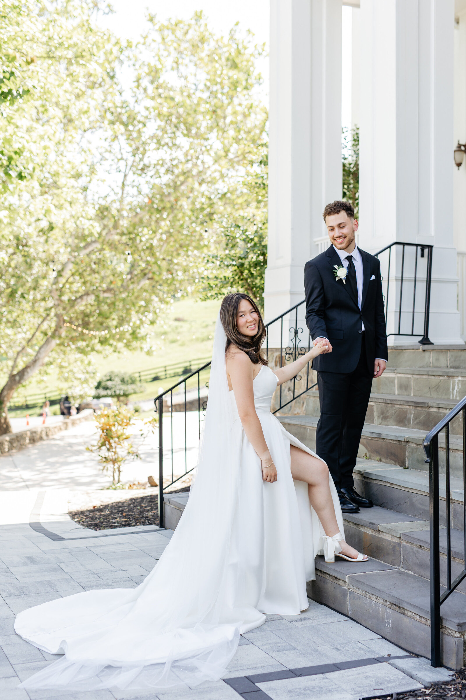 Bride walking down the steps toward the groom at The View at Bluemont