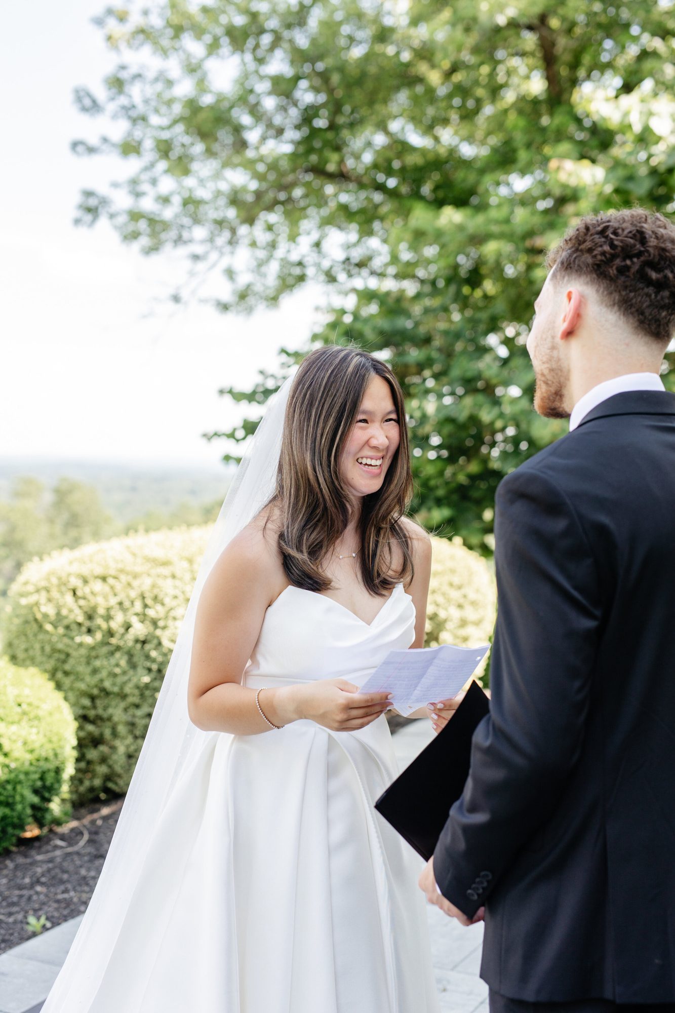 Bride reading a letter to the groom at The View at Bluemont
