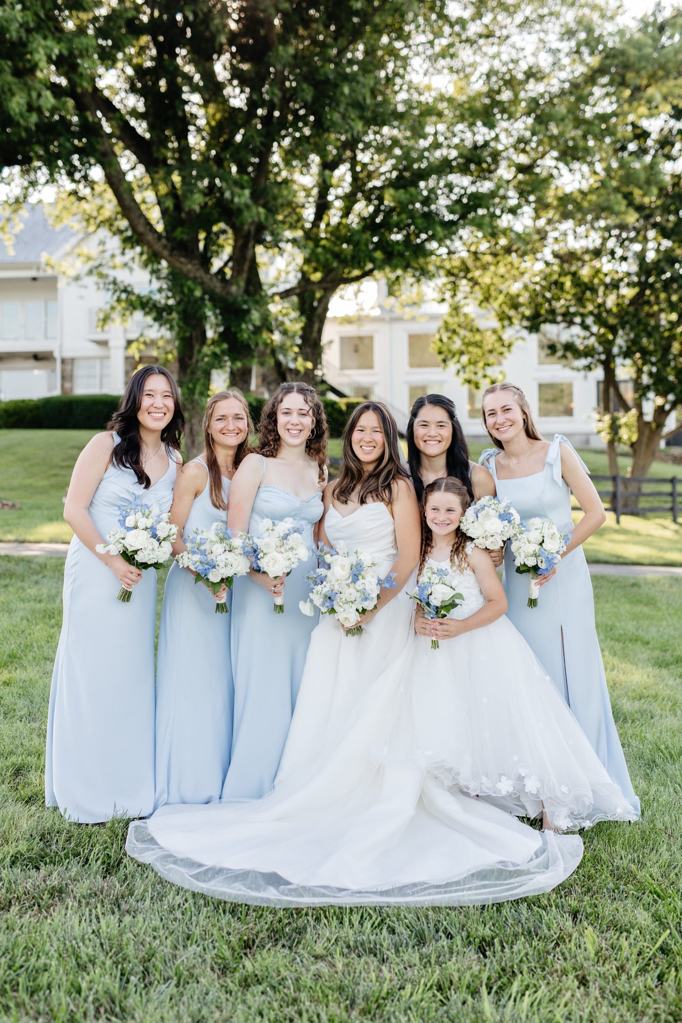 Bride with her bridesmaids on the lawn at The View at Bluemont