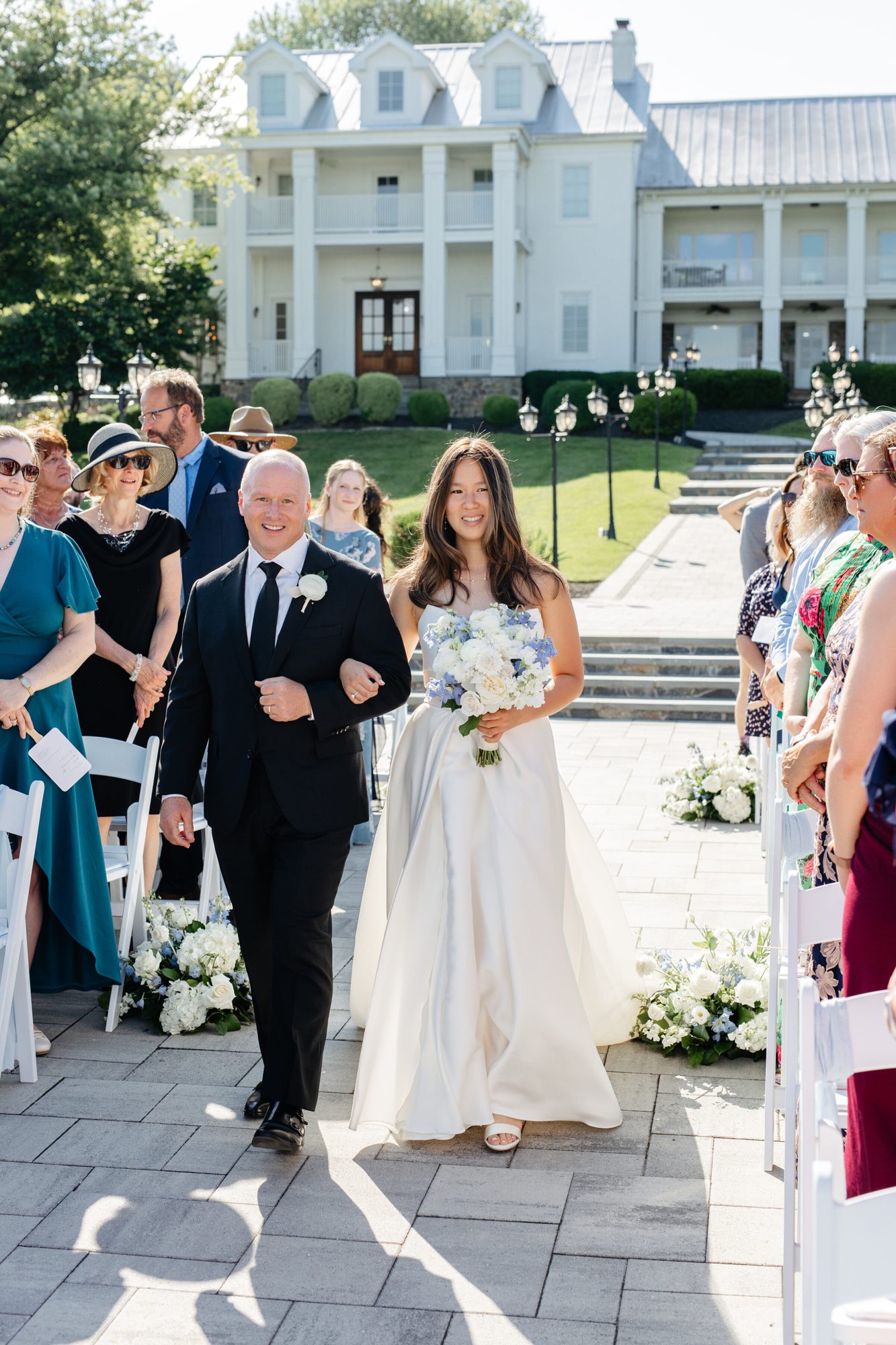 Bride walking down the aisle with her father at The View at Bluemont