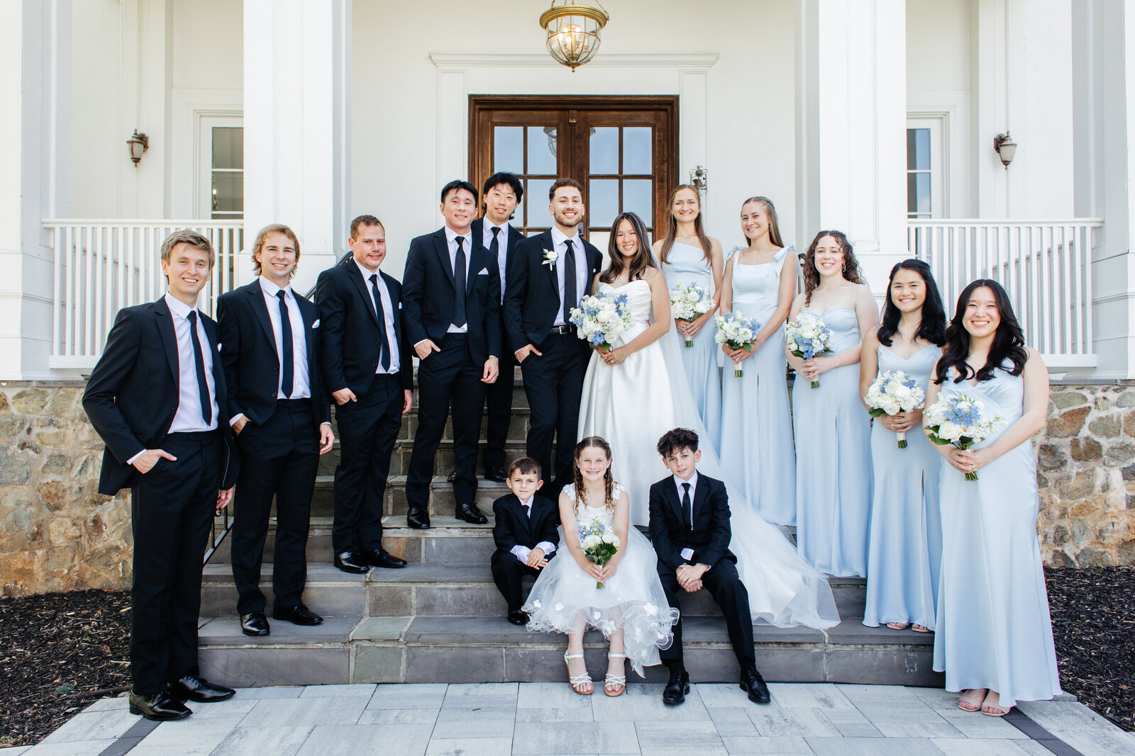 Full wedding party on the front steps at The View at Bluemont at The View at Bluemont