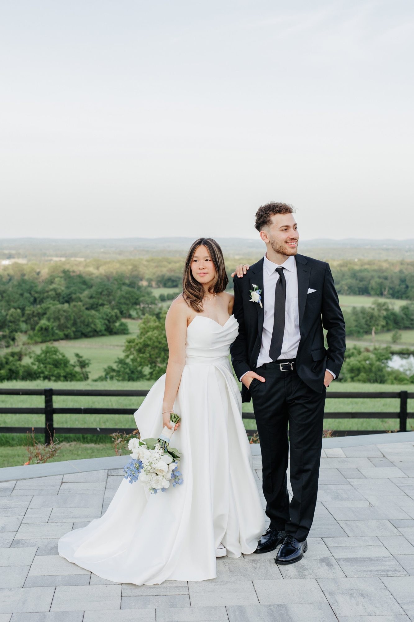 Couple standing on the terrace with countryside views at The View at Bluemont