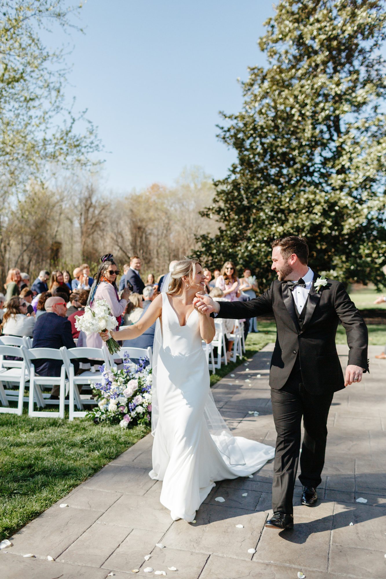 Newlyweds walking back up the aisle at Historic Whitewood
