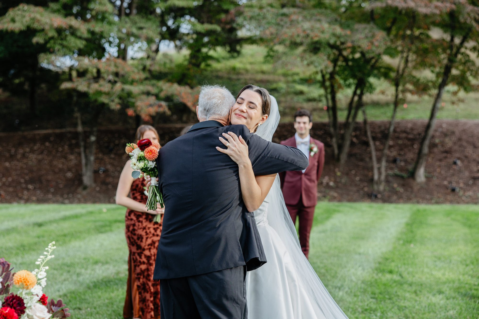 Father hugging the bride before the ceremony at Boars Head Resort