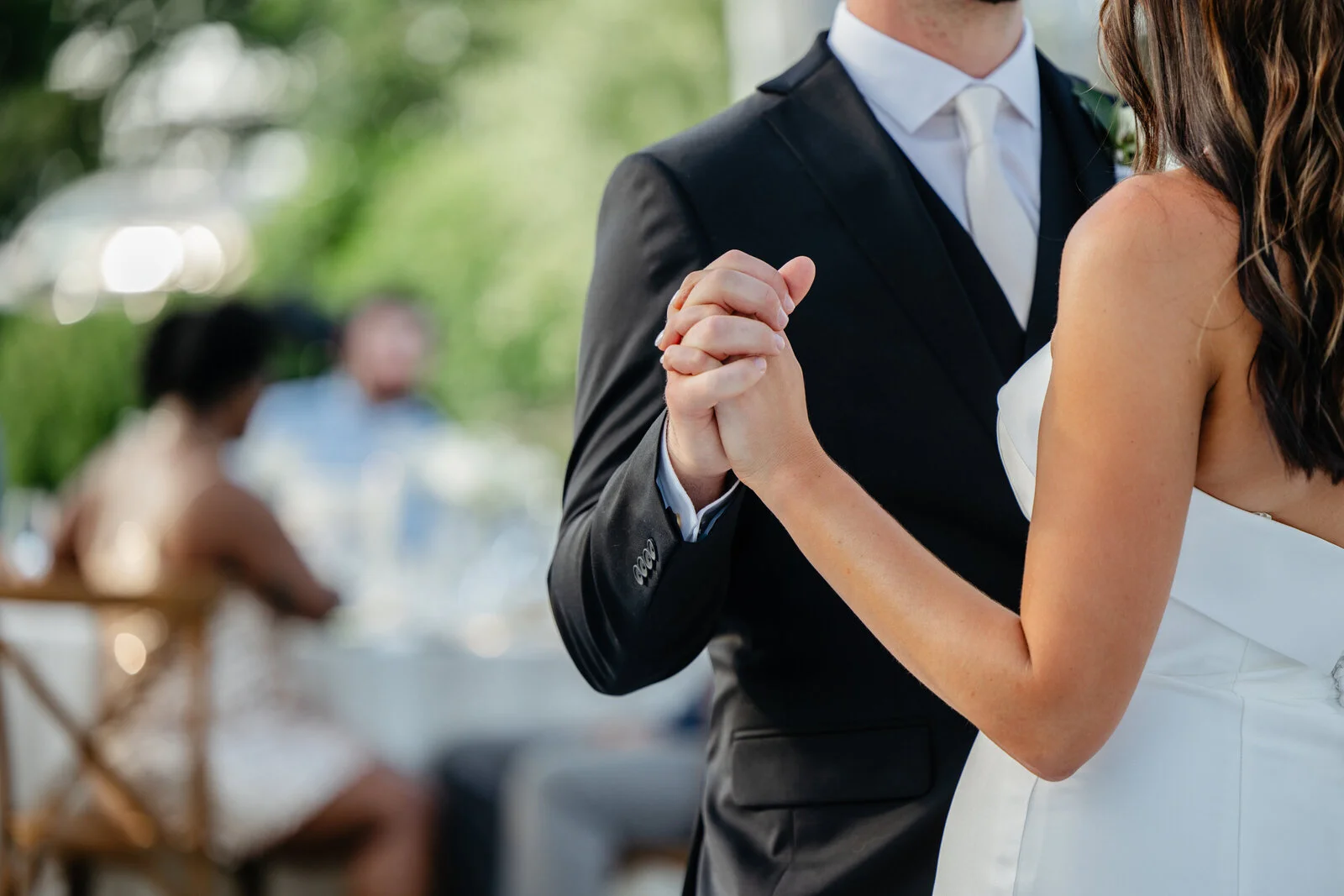 Couple clasping hands while dancing