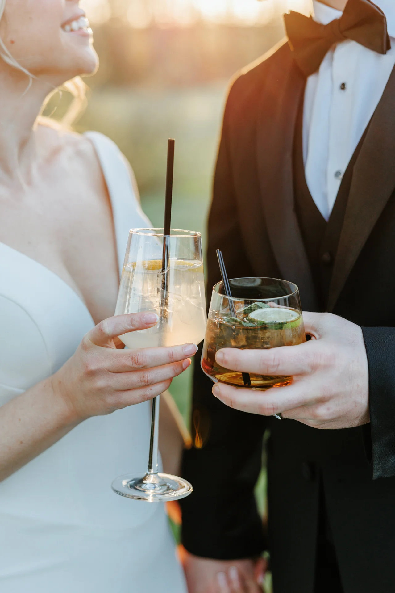 Couple holding drinks together