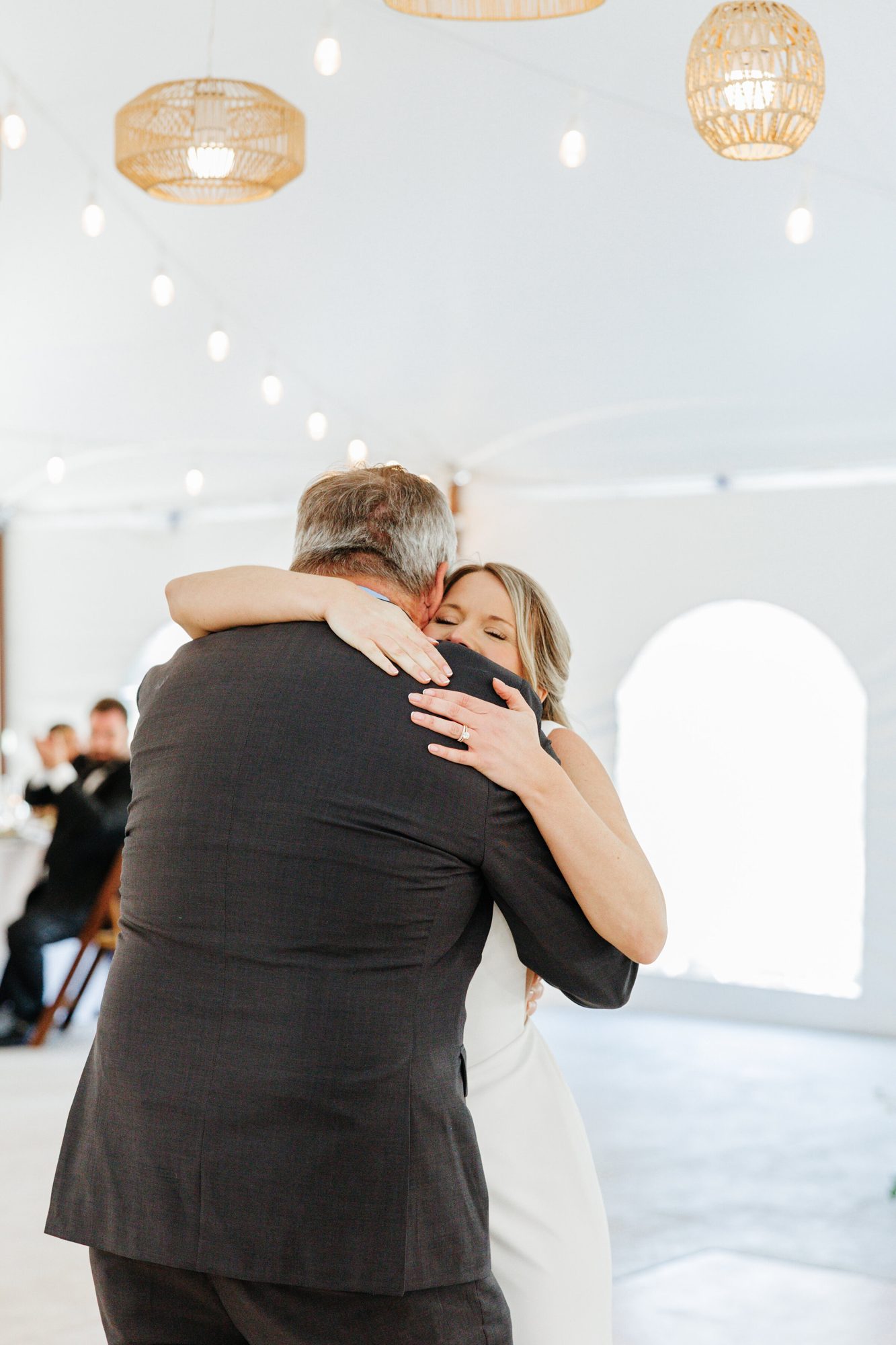 Bride hugging her father during their dance at Historic Whitewood