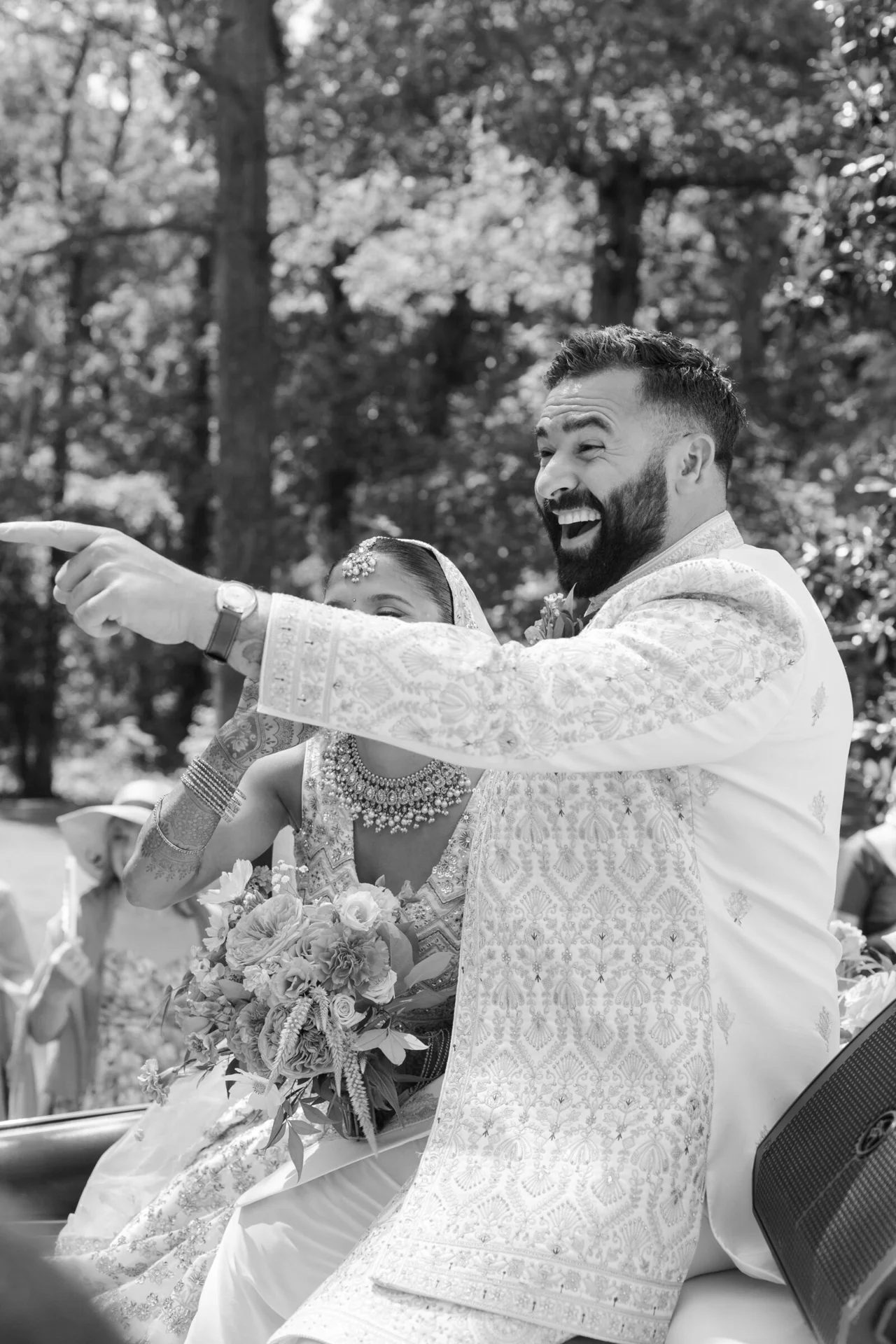 Couple laughing and pointing during their ceremony