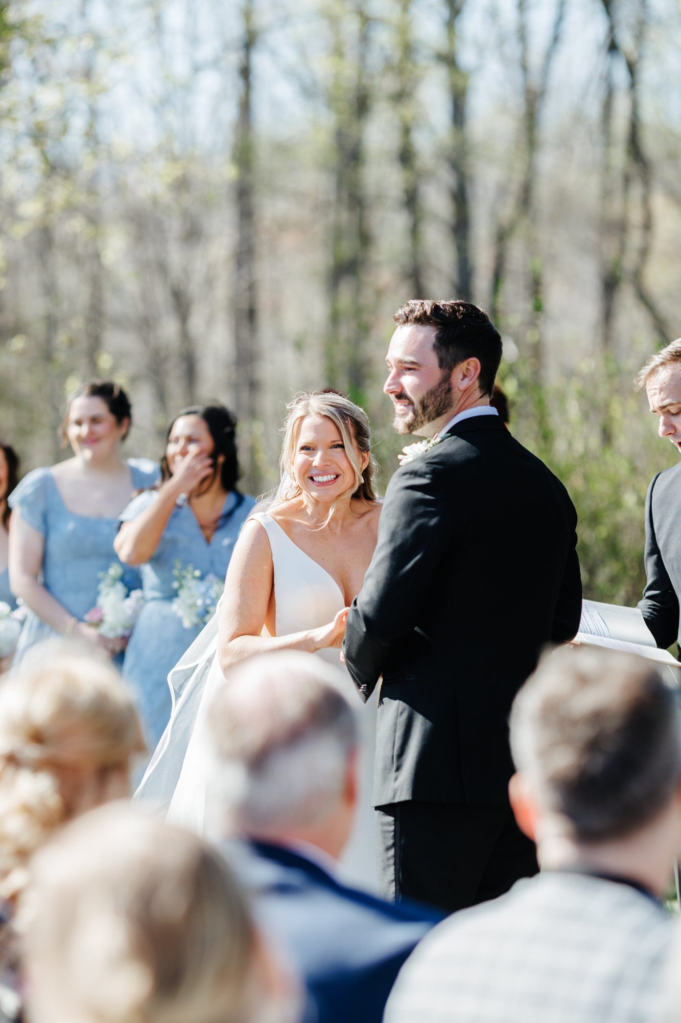 Couple smiling during the outdoor ceremony at Historic Whitewood