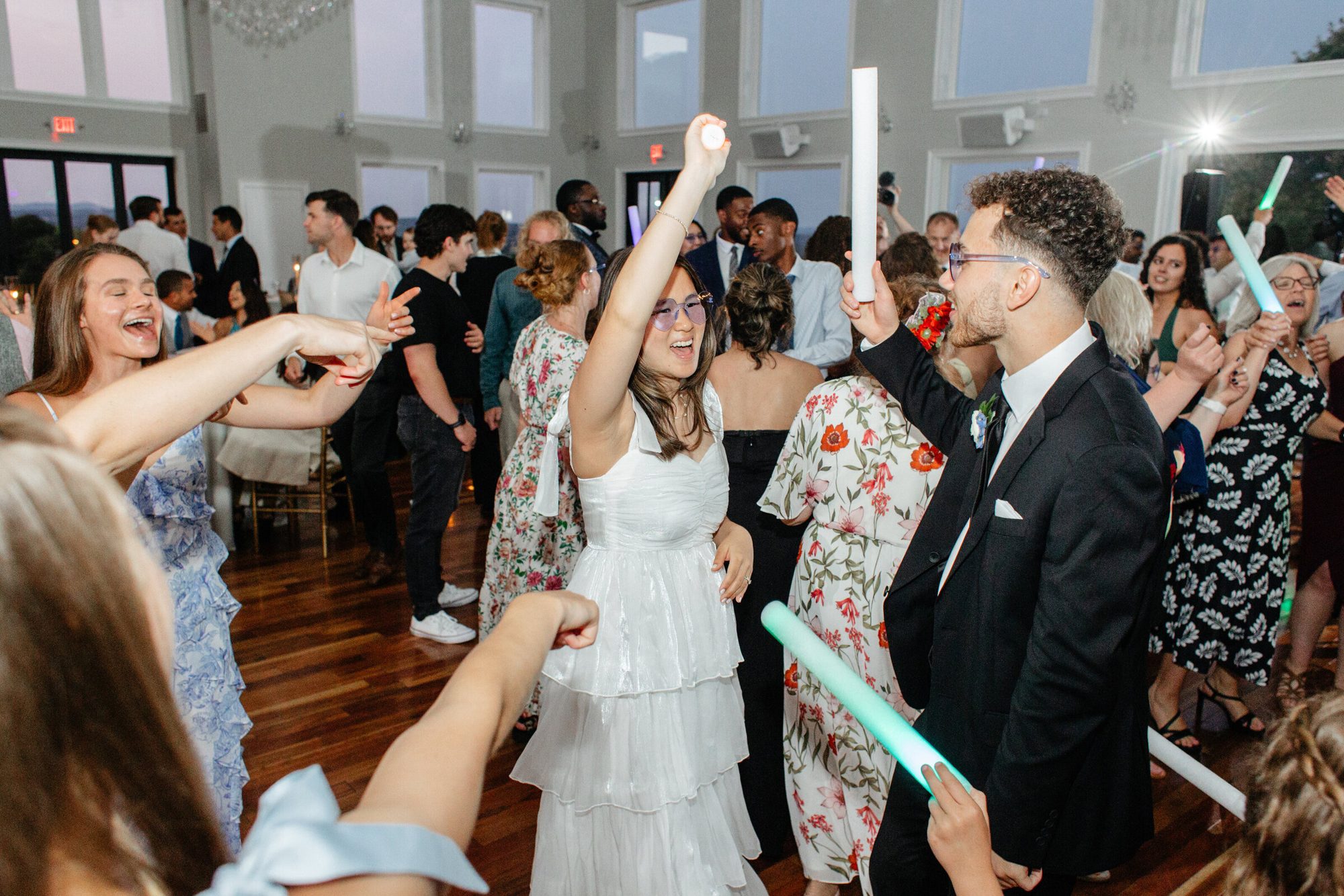 Guests celebrating with the couple on the dance floor at The View at Bluemont