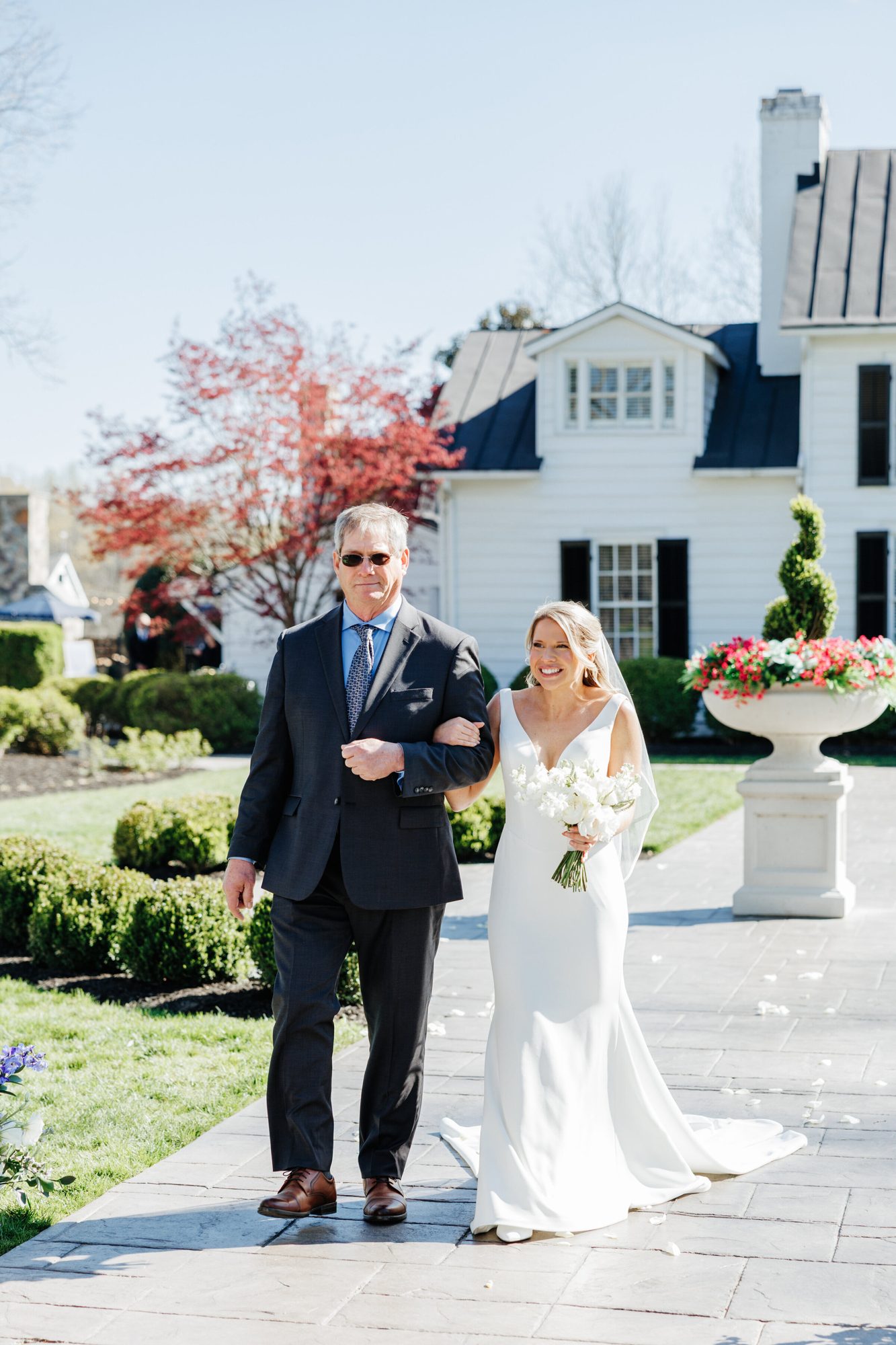 Bride walking down the aisle with her father at Historic Whitewood