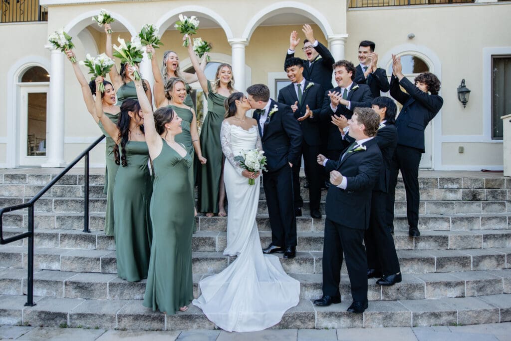 A relaxed bride laughing with her bridesmaids before the ceremony, capturing the feeling of a stress free wedding day.