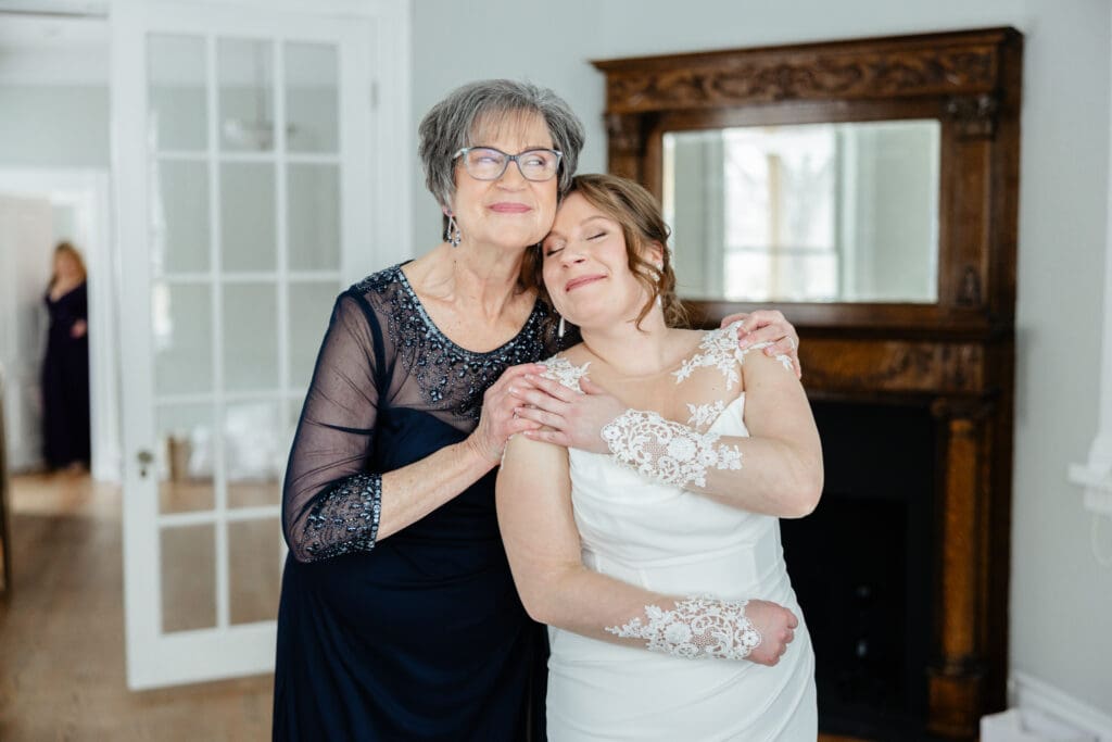 A photographer reviewing a wedding photography shot list with the couple before their ceremony begins.