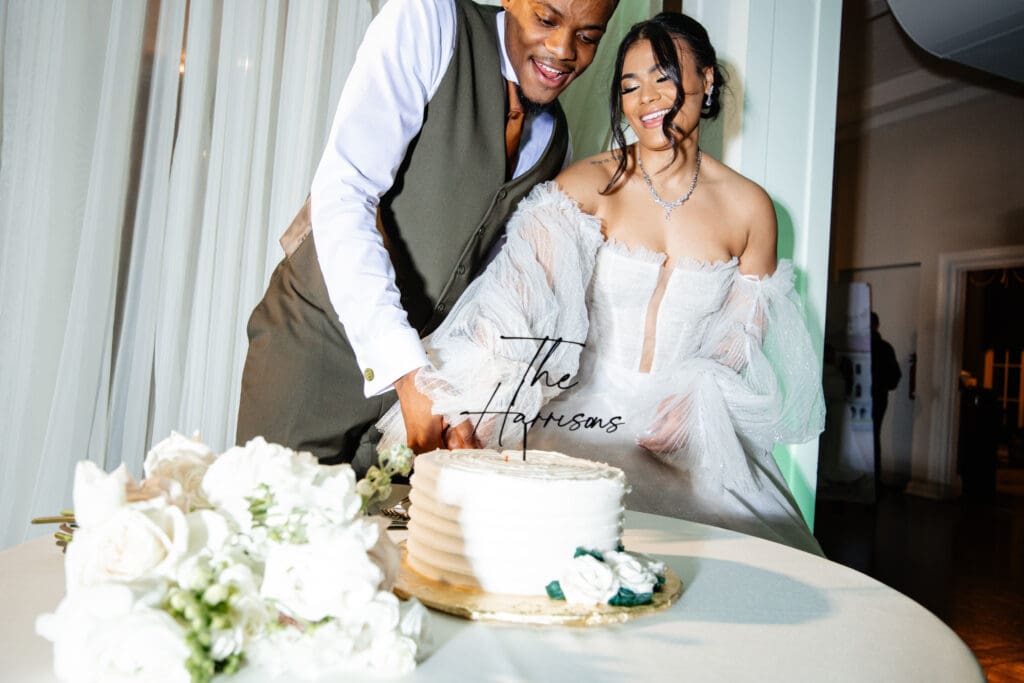 A photographer capturing a couple's candid moment during portraits, showing what to consider when choosing your wedding photographer.