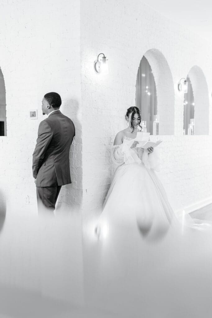 A couple reading personal vows to each other during the ceremony, capturing emotional wedding vow exchange photos.